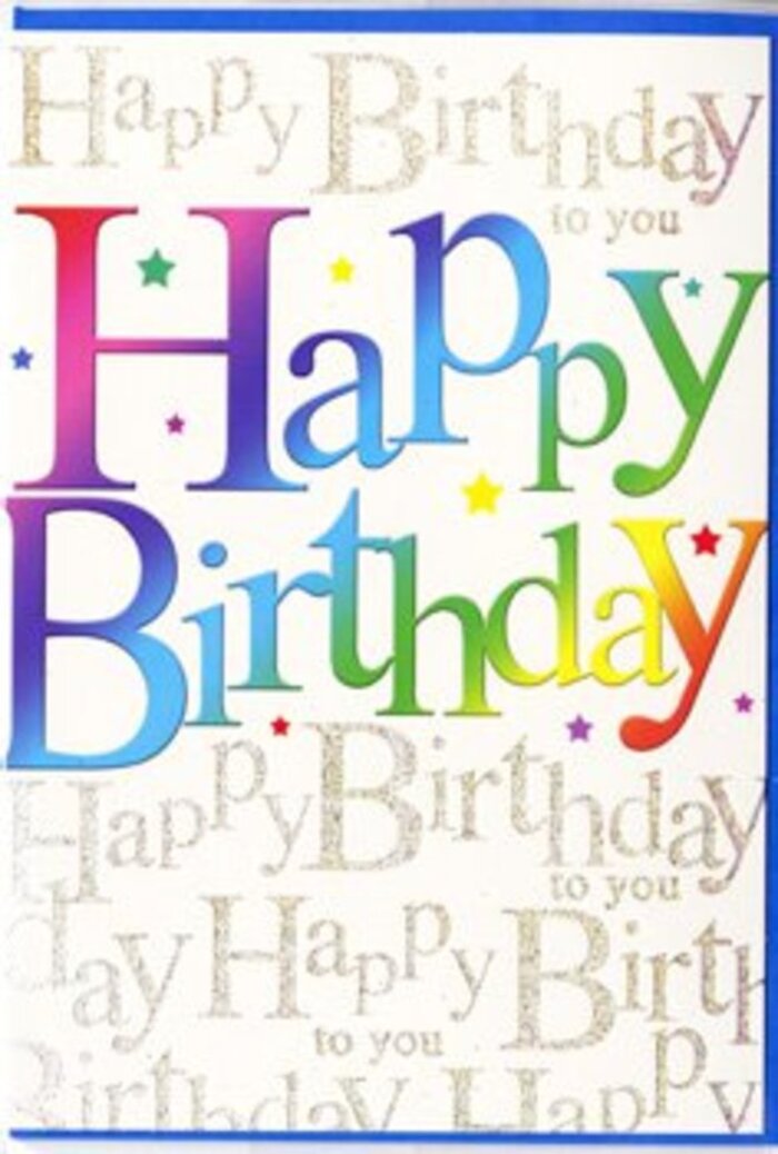 In this close-up photograph of a birthday greeting card, the entire composition is devoted to the joyful power of typography and colour, much like a florist in Weybridge might build excitement using only bright blooms and fresh foliage. Across the centre of the card, the words Happy Birthday are written in large, chunky letters that fill most of the space, each character saturated with a rich gradient of rainbow tones. The colours shift smoothly along the phrase, starting with deep cherry reds and rosy pinks, moving through jewel-like purples and cobalt blues, then on to turquoise, leaf green and finally warm accents of golden yellow, like a row of party balloons lined up along the River Wey on a clear day. The lettering has a slightly glossy, printed finish that suggests a smooth, almost silky card stock beneath your fingertips. Behind this vivid message, the entire background is patterned with a continuous flow of fine script, repeating Happy Birthday to you in slender golden handwriting. These delicate lines slant diagonally and overlap softly, creating the impression of a shimmering veil or a curtain of gold tinsel hanging behind the bolder text. The gold appears subtly metallic, catching imagined light as though the card were standing on a mantel in a Weybridge townhouse, reflecting the glow of candles. Between the letters, faint star-like shapes and specks of colour scatter quietly, hinting at confetti or sparklers just out of focus. There are no additional images or illustrated characters, just the balance between exuberant rainbow lettering and the refined, sparkling script. The overall feel is festive yet grown-up, ideal for celebrating a milestone birthday and pairing with an uplifting arrangement prepared by a Weybridge florist for local delivery.