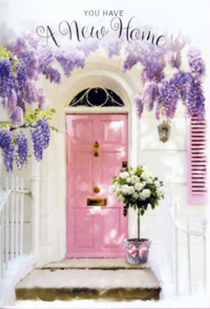 At this charming Weybridge doorway, you can almost smell the sweet, powdery perfume of wisteria as it drapes itself in velvety strands over a pale pink front door. The blossoms spill from above in cascading clusters of lavender and soft purple, their dangling racemes forming a dreamy canopy that turns the small entrance into a secret haven, reminiscent of quiet lanes off Queens Road after a spring shower. The door, painted in a gentle blush shade, is framed by simple whitewashed walls and a softly toned shutter that catches the light in delicate, uneven patches, hinting at age, character, and careful upkeep. Just in front of the threshold, slightly off-centre, a grey tin bucket takes pride of place. It is generously filled with creamy white roses, each flower fully open yet still plush, the petals curling at the edges like silk. Sprays of fresh green foliage peek out between the blooms, lending depth, natural movement, and a hint of woodland freshness to the arrangement. A satin ribbon in a muted pink hue is tied around the bucket's base, its flowing ends resting against the cool metal, harmonising with the colour of the door and adding a soft, romantic detail. The whole composition feels like a heartfelt housewarming gift, perhaps delivered by a local florist to mark the keys changing hands on a pretty Weybridge terrace. There is a quiet thrill in the air, a mixture of excitement and tenderness, as if the flowers are there to witness first steps into a new home, to bless it with beauty, calm, and the promise of unfolding memories.